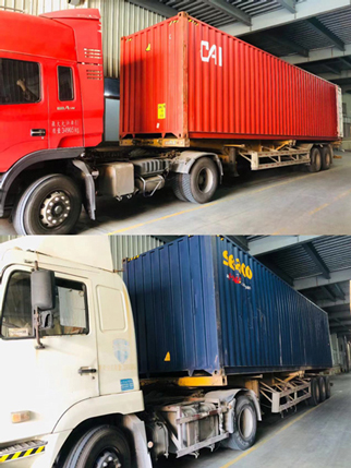 Zwei Containerlastwagen beladen Babywindeln.